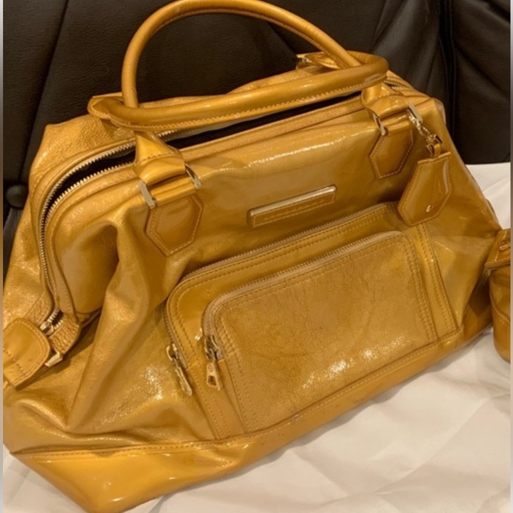 INQUIRIES:Gold Longchamp Legende Vermis vintage Very Good cond. Clean No smells